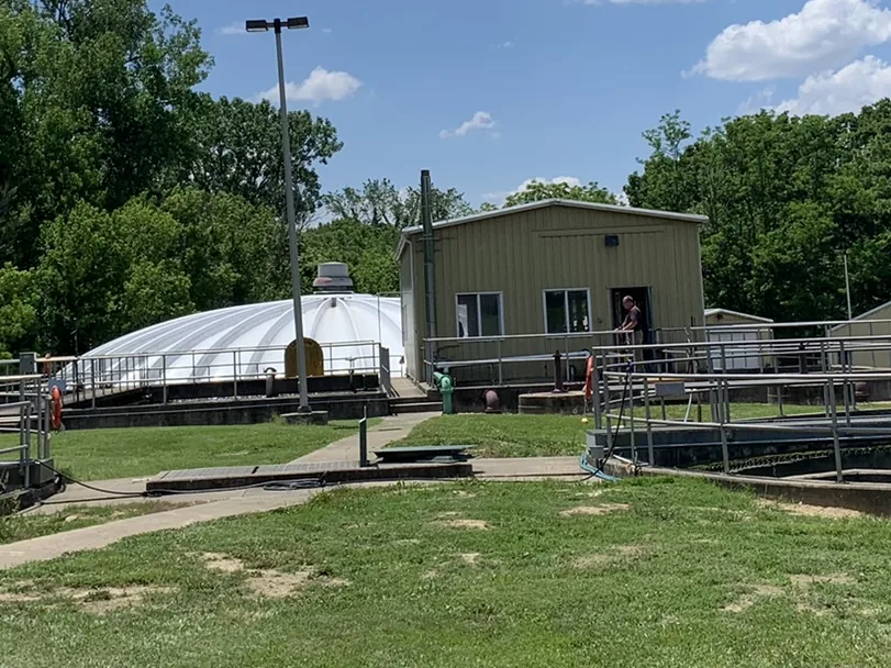 Exterior of a municipal waste water treatment plant, with aeration basins and the operations building
